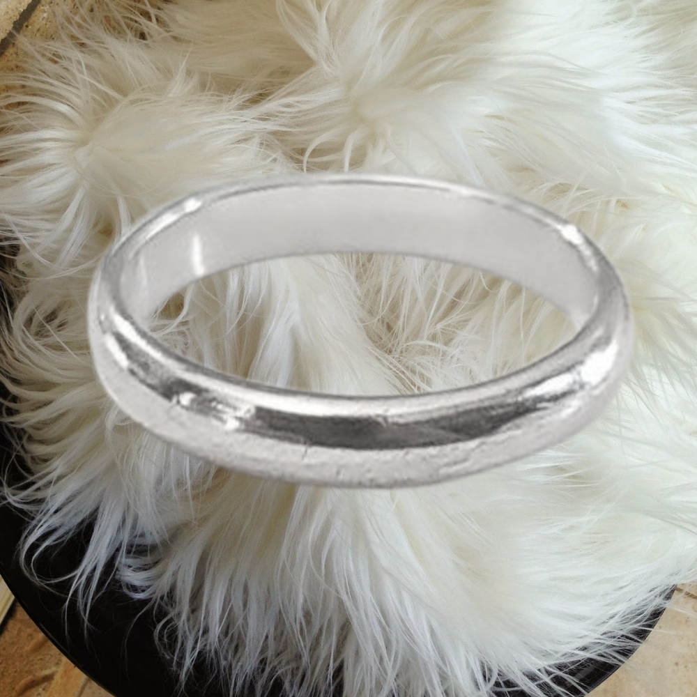 Sterling Silver Band with $CZC Hallmark. Size 8